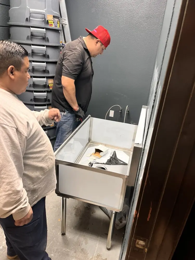 Commercial plumbing and sink installation in Halls